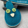 close up of teal kitty slipper face by Joe's Toes