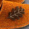 Joe's Toes Oak leaf slipper close up of suede leaf