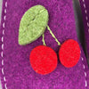 close up of Joe's Toes cherie Cherry design wool felt slippers
