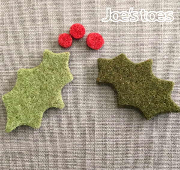 A pair of Joe's Toes Felt Holly Leaves and Berries